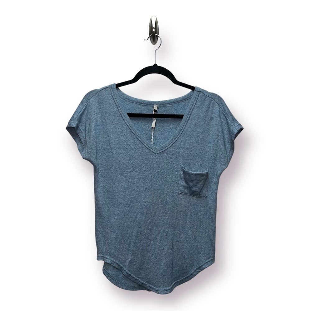 Poof! Light blue shirt with small open detailing on back. Size S.